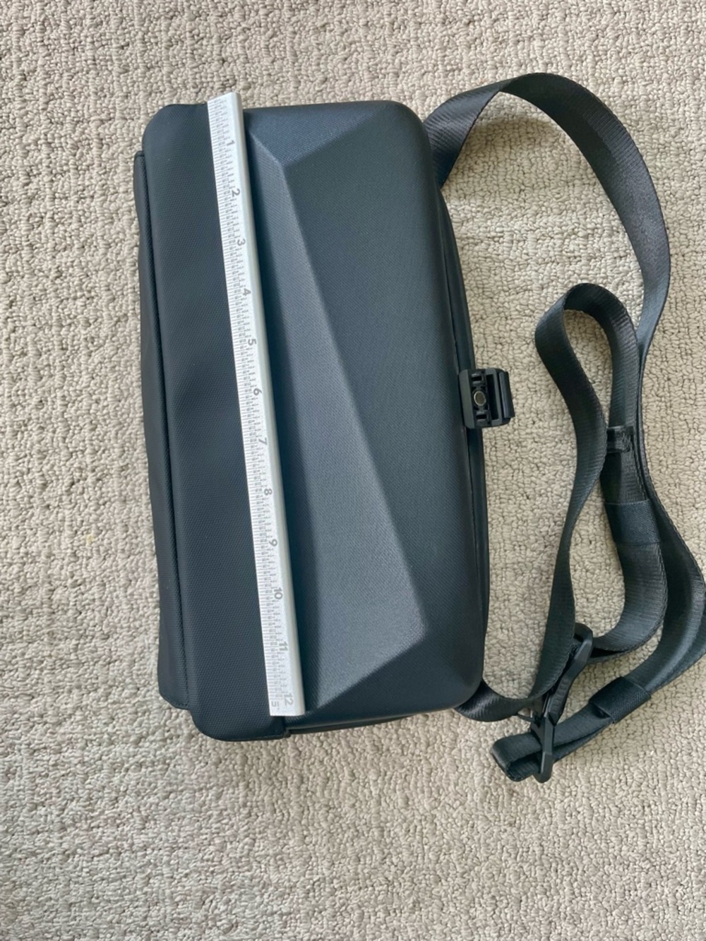 Men's Black Hard-Shell Sling Bag with Adjustable Strap, magnetic closures